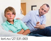 Offended man and stubborn teenager. Стоковое фото, фотограф Яков Филимонов / Фотобанк Лори