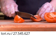 The chef in black apron cuts vegetables. Стоковое видео, видеограф Игорь Кузнецов / Фотобанк Лори