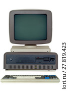 Old computer (late 80's) with a horizontal system unit, a drive for six-inch floppy disks and a CRT monitor and a keyboard isolated. Стоковое фото, фотограф Евгений Харитонов / Фотобанк Лори