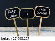 Keep Calm and Fake Success message written with chalk on mini blackboard labels. Стоковое фото, фотограф Constantin Stanciu / PantherMedia / Фотобанк Лори