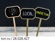 Concept message LOCAL MARKETING and light bulb as symbol for idea. Стоковое фото, фотограф Constantin Stanciu / PantherMedia / Фотобанк Лори