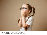 Портрет удивленной маленькой девочки. Стоковое фото, фотограф Иван Карпов / Фотобанк Лори