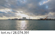 Panoramic view of Sochi sea port, Olympic rings in the sunset light, calm sea (2017 год). Стоковое видео, видеограф Ирина Мойсеева / Фотобанк Лори