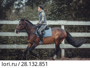Spring teenage girl jump horse ride jumping. Стоковое фото, фотограф Julia Shepeleva / Фотобанк Лори