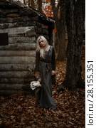Witch in a long black dress. Стоковое фото, фотограф Евгения Литовченко / Фотобанк Лори