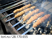Spits with luleh kebab on the grill over hot coals, close-up. Стоковое фото, фотограф Losevsky Pavel / Фотобанк Лори