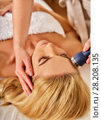 Ultrasonic facial treatment on ultrasound man face machine. Стоковое фото, фотограф Gennadiy Poznyakov / Фотобанк Лори