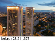 MOSCOW, RUSSIA - JUL 8, 2016: Buildings on Begovaya street at night, twin 38-storey towers - is part of largest residential complex with 1946 apartments in Moscow. Редакционное фото, фотограф Losevsky Pavel / Фотобанк Лори