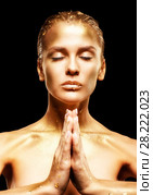 Golden Female with  closed eyes and hands folded in prayer. Стоковое фото, фотограф Сергей Пристяжнюк (Serg Zastavkin) / Фотобанк Лори