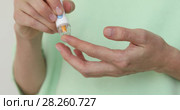 Girl diabetic puncture finger to measure blood. Стоковое видео, видеограф Ekaterina Demidova / Фотобанк Лори
