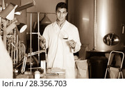 Young male laboratorian working with wine. Стоковое фото, фотограф Яков Филимонов / Фотобанк Лори