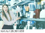 Girl looking for blender in store. Стоковое фото, фотограф Яков Филимонов / Фотобанк Лори