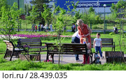 Moscow, Russia - May 15. 2018. mothers with children on boulevard near benches in Zelenograd. Редакционное видео, видеограф Володина Ольга / Фотобанк Лори