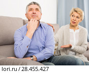dissatisfied mature couple quarreling at home with each other. Стоковое фото, фотограф Яков Филимонов / Фотобанк Лори