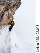 A dengerous pitch during an extreme winter climbing. Dolomiti (East Alps), Trentino, Italy, Europe. Стоковое фото, агентство Ingram Publishing / Фотобанк Лори