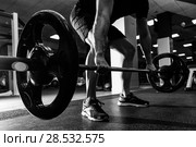 Closeup of weightlift workout at the gym with barbell. Man wearing sportswear clothes. Стоковое фото, фотограф Javier Sánchez Mingorance / Ingram Publishing / Фотобанк Лори