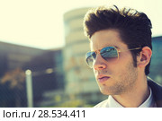 Portrait of a handsome young man with sunglasses. Стоковое фото, фотограф Javier Sánchez Mingorance / Ingram Publishing / Фотобанк Лори
