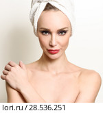 Beautiful blond woman with white towel on her head. Young girl with blue eyes and red lips. Стоковое фото, фотограф Javier Sánchez Mingorance / Ingram Publishing / Фотобанк Лори