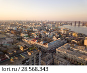 The panoramic bird's eye view from drone to the central historical part of the city Kiev - the Podol district, the Dnieper River in Kiev, Ukraine at summer sunset. Стоковое фото, фотограф Ярослав Данильченко / Фотобанк Лори