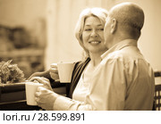 Mature couple on balcony with coffee. Стоковое фото, фотограф Яков Филимонов / Фотобанк Лори