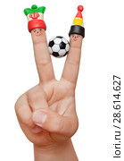 Two fingers in the clay caps with a soccer ball isolated on white background. Fans of Iran and Egyptian. Стоковое фото, фотограф Элина Гаревская / Фотобанк Лори