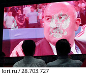 Москва, главный тренер сборной России на экране фан-зоны, матч Россия-Хорватия (2018 год). Редакционное фото, фотограф Дмитрий Неумоин / Фотобанк Лори