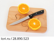 Orange pieces on a wooden board and knife. Стоковое фото, фотограф Георгий Ильин / Фотобанк Лори