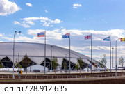 Russia, Samara, June 2018: national flags, countries participating in the World Cup, against the backdrop of the stadium. Стоковое фото, фотограф Акиньшин Владимир / Фотобанк Лори