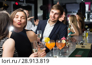 Two female colleagues are exchanging compliments to each other. Стоковое фото, фотограф Яков Филимонов / Фотобанк Лори