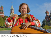 Performer with music instrument gusli. Стоковое фото, фотограф Алексей Кузнецов / Фотобанк Лори