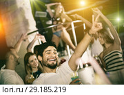 positive male joying and thumbs up on party in the club with coc. Стоковое фото, фотограф Яков Филимонов / Фотобанк Лори
