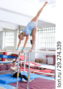 Couple doing exercises on parallel bars. Стоковое фото, фотограф Яков Филимонов / Фотобанк Лори