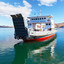 Baikal Lake. Freight regular passenger ferry arrives from Olkhon Island on a sunny autumn day (translation of the ship’s name: Olkhon Gate) (2018 год). Редакционное фото, фотограф Виктория Катьянова / Фотобанк Лори