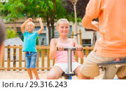 Children are teetering on the swing. Стоковое фото, фотограф Яков Филимонов / Фотобанк Лори