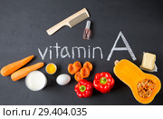 Food sources of natural vitamin A and hairbrush with nail polish. Top view. Healthy diet concept. Стоковое фото, фотограф Комарова Арина / Фотобанк Лори