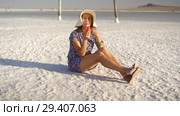 happy smiling girl enjoying the sunset, eating watermelon, sit on salt, pillars. Стоковое видео, видеограф Ирина Мойсеева / Фотобанк Лори