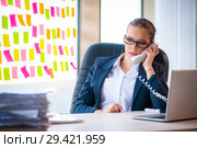 Beautiful female employee with many conflicting priorities. Стоковое фото, фотограф Elnur / Фотобанк Лори