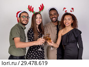 A group of friends celebrate the new year and clink glasses of champagne. Стоковое фото, фотограф Женя Канашкин / Фотобанк Лори