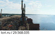 Aerial view on metal recycling site over blue sky,Freight train, ship and scrap metal in port (2018 год). Редакционное видео, видеограф Виктор Аллин / Фотобанк Лори