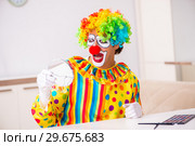 Male clown preparing for perfomance at home. Стоковое фото, фотограф Elnur / Фотобанк Лори
