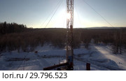 Ремонт нефтяной скважины зимой. Вид с воздуха. Oil well repair in winter. Aerial view. Стоковое видео, видеограф Евгений Романов / Фотобанк Лори