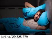 Tired exhausted man sleeping in his bed. Стоковое фото, фотограф Elnur / Фотобанк Лори