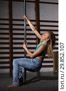 Woman on pylon in lightless studio. Стоковое фото, фотограф Яков Филимонов / Фотобанк Лори