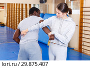 People fighting with coach at gym. Стоковое фото, фотограф Яков Филимонов / Фотобанк Лори