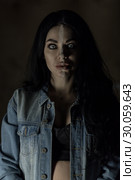 Scary woman with mad eyes in darkness. Стоковое фото, фотограф Art Konovalov / Фотобанк Лори