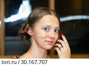 Portrait of a fair-haired smiling girl. A close-up portrait of a horizontal format, made in the evening in a summer terrace with artificial lighting. Стоковое фото, фотограф Вадим Орлов / Фотобанк Лори