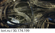 Aerial view of lighted highway road junctions at night. Стоковое видео, видеограф Яков Филимонов / Фотобанк Лори