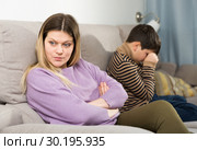 Upset mother and offended son crying after quarrel at home. Стоковое фото, фотограф Яков Филимонов / Фотобанк Лори