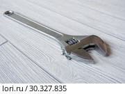 Adjustable wrench on the table close up. Стоковое фото, фотограф Евгений Харитонов / Фотобанк Лори