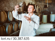 Professional taster posing with glass of wine. Стоковое фото, фотограф Яков Филимонов / Фотобанк Лори